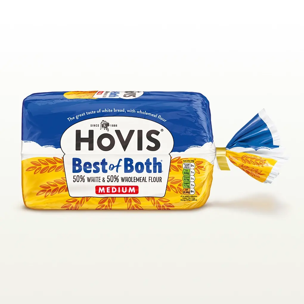 A Hovis Best of Both loaf thickly sliced sits within a white back drop with a subtle shadow below the bread. 