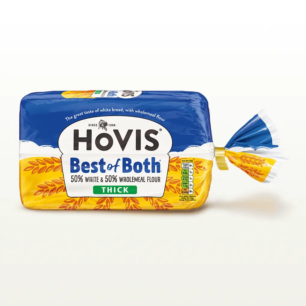 A Hovis Best of Both loaf thickly sliced sits within a white back drop with a subtle shadow below the bread. 