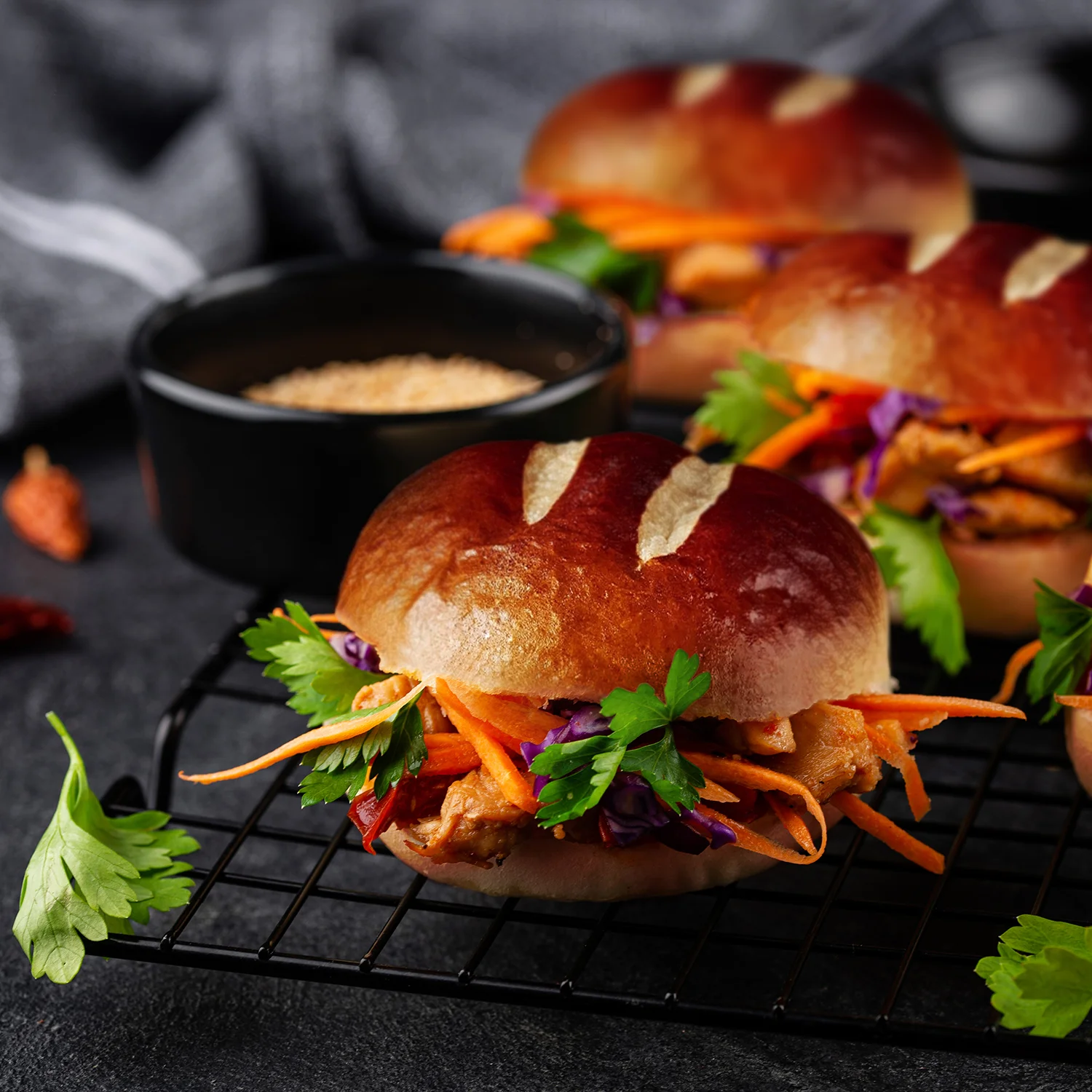 Close up of some Char Siu Banh Mi (Chinese BBQ Pork Sandwich Buns) in soft Hovis® Premium Burger Buns with coriander.